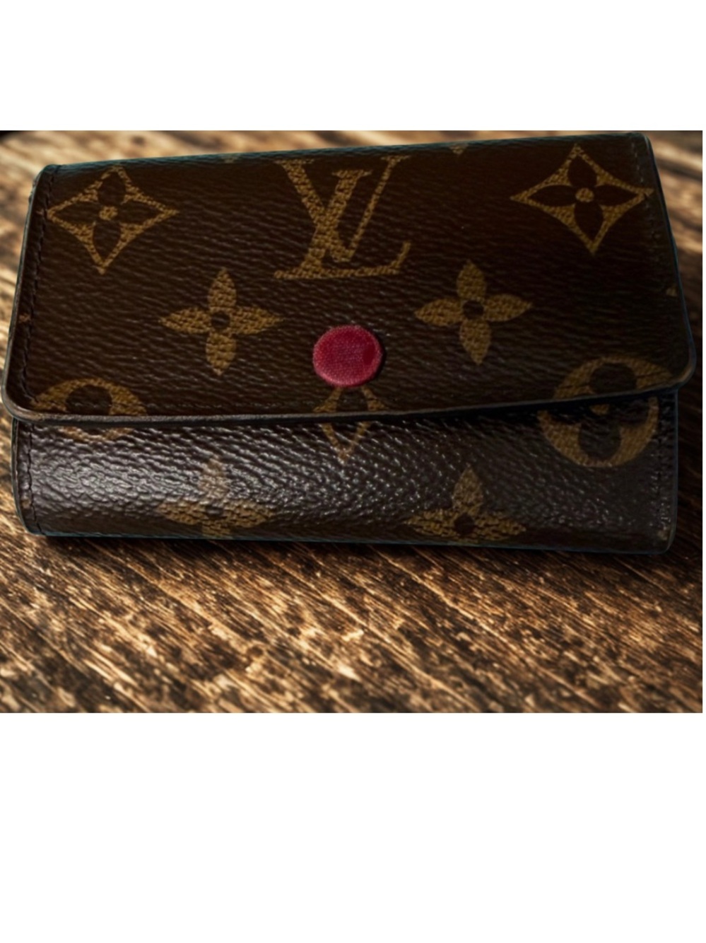 Louis Vuitton 6 Key Holder in Monogram canvas, fuchsia interior.